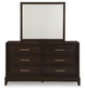 Neymorton King Upholstered Panel Bed with Mirrored Dresser